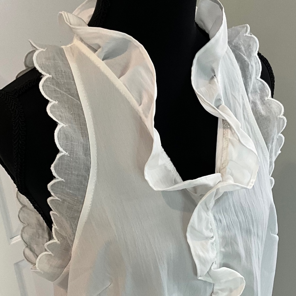 Sleeveless White Tunic with Ruffles